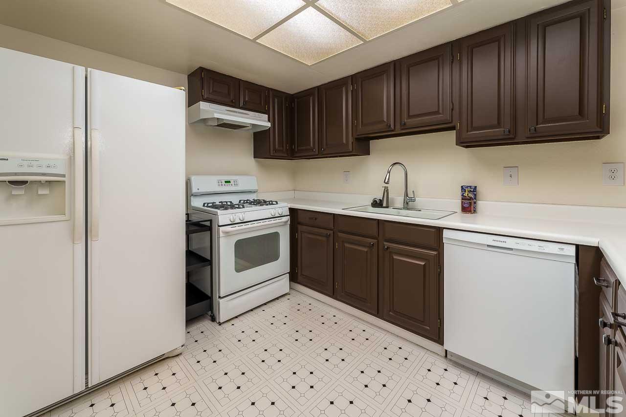 2300 Dickerson Road, Unit 36 Reno, NV 89503 - Photo 12 of 25 a kitchen with a stove sink and cabinets