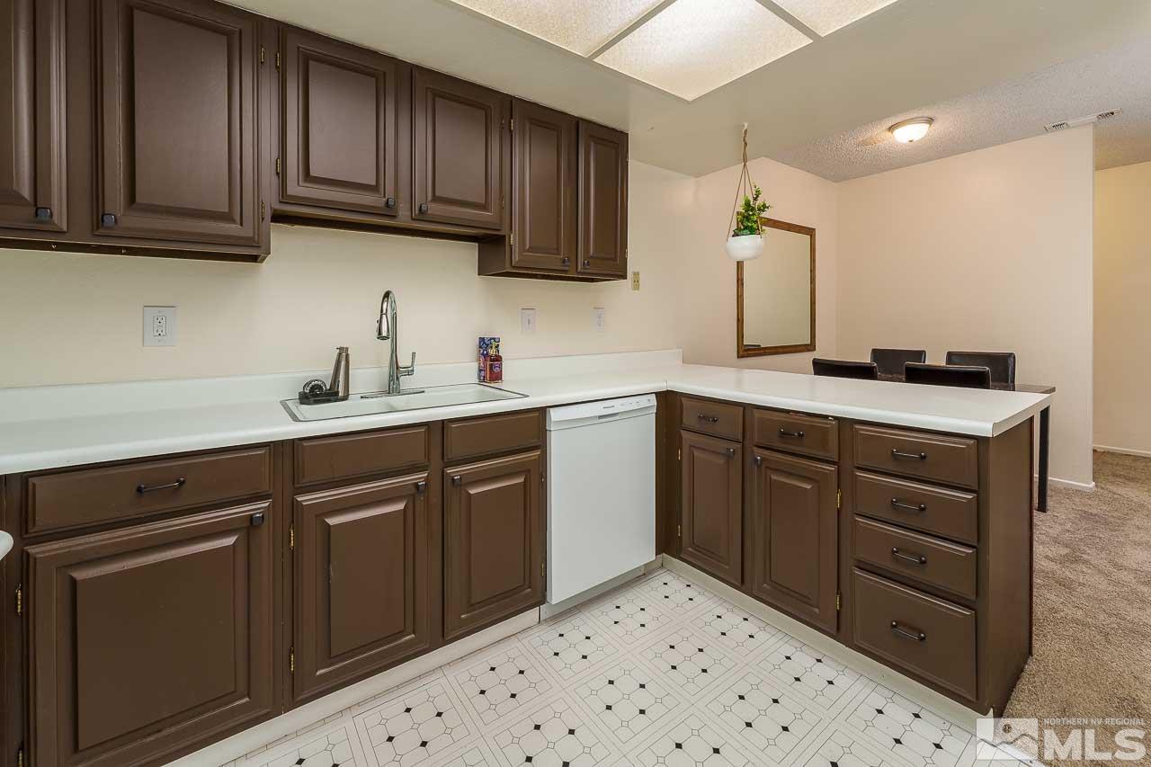 2300 Dickerson Road, Unit 36 Reno, NV 89503 - Photo 13 of 25 a kitchen with a sink stove and cabinets