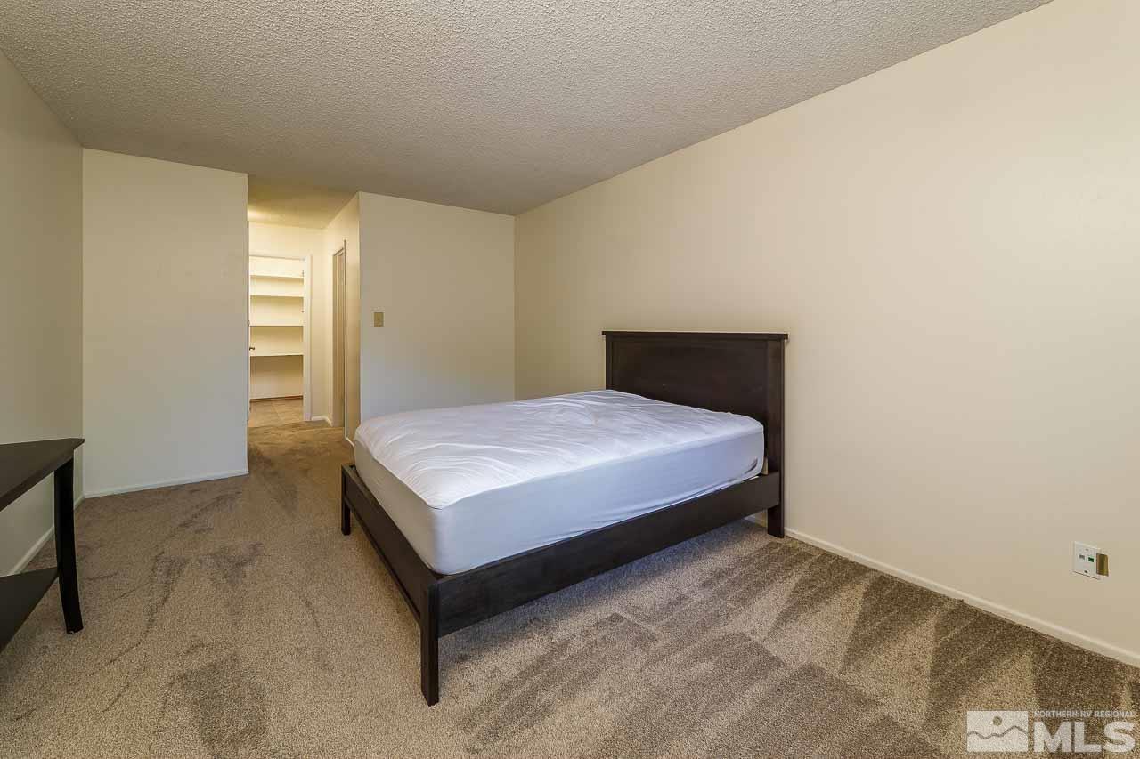 2300 Dickerson Road, Unit 36 Reno, NV 89503 - Photo 21 of 25 a bedroom with a bed and window