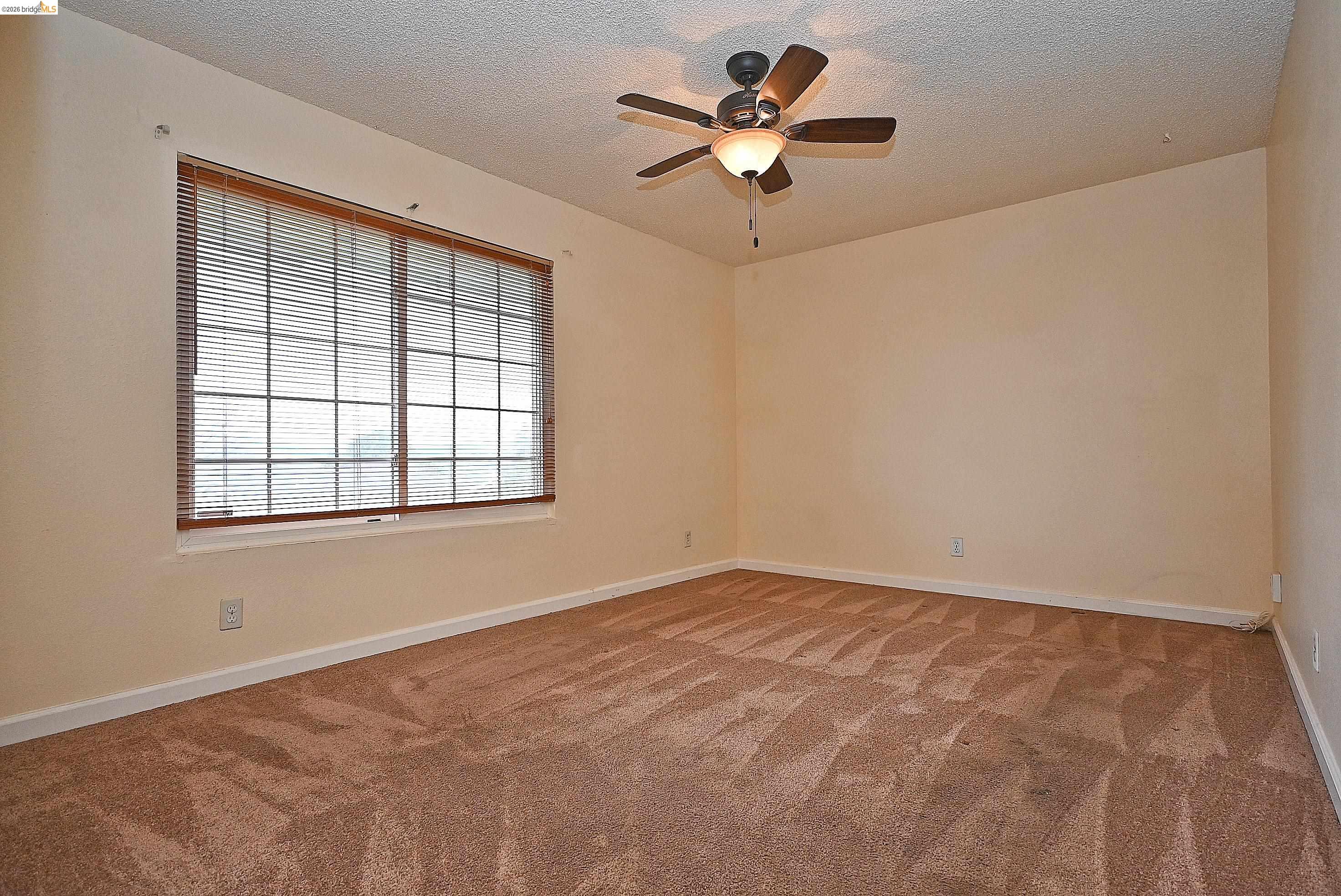 159 Coleridge Drive Vallejo, CA 94591 - Photo 29 of 33 Carpeted spare room with ceiling fan and a textured ceiling