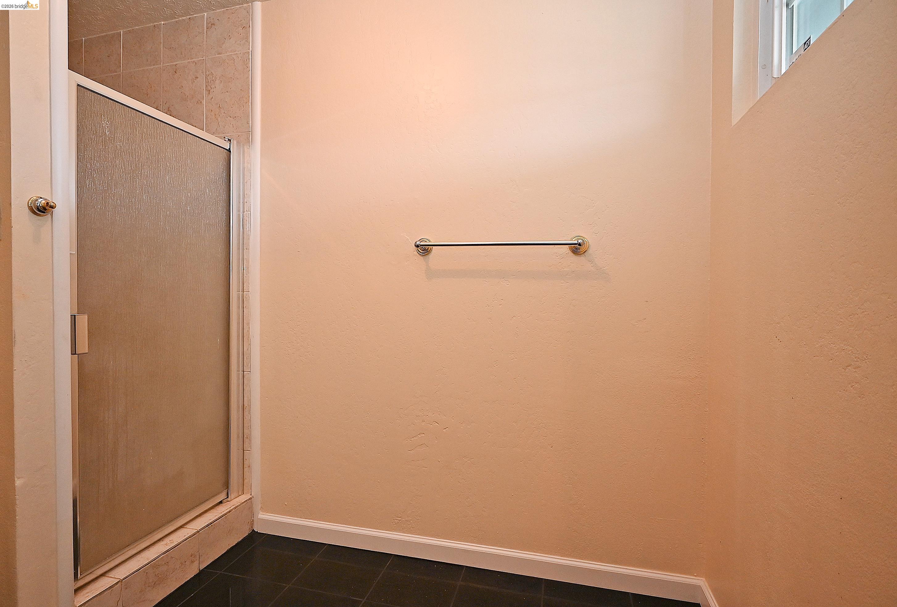 159 Coleridge Drive Vallejo, CA 94591 - Photo 32 of 33 Full bath featuring a shower stall and dark tile patterned flooring