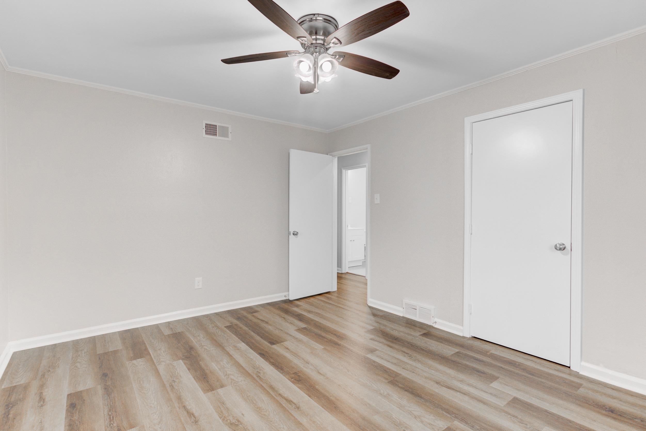 1784 Sea Isle Road Memphis, TN 38117 - Photo 18 of 27 Unfurnished bedroom featuring crown molding, ceiling fan, and light wood finished floors