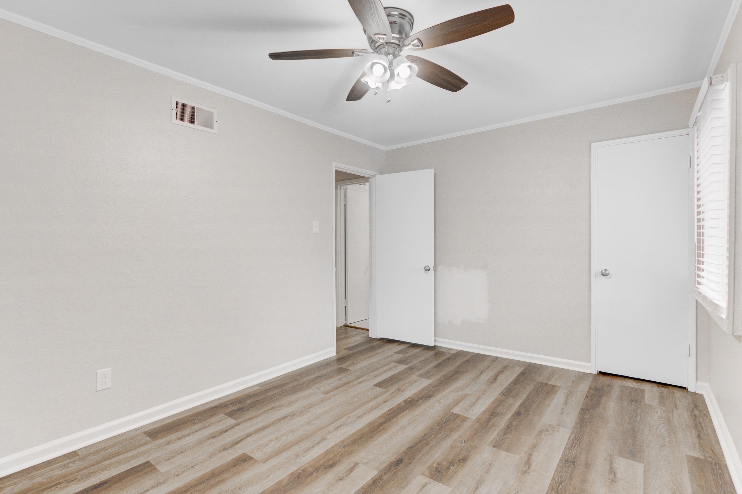 1784 Sea Isle Road Memphis, TN 38117 - Photo 23 of 27 Unfurnished bedroom featuring crown molding, a ceiling fan, and light wood-style flooring