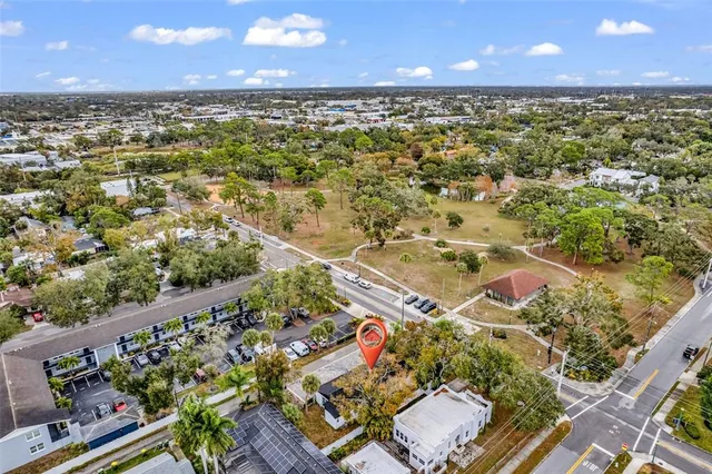an aerial view of residential houses with outdoor space