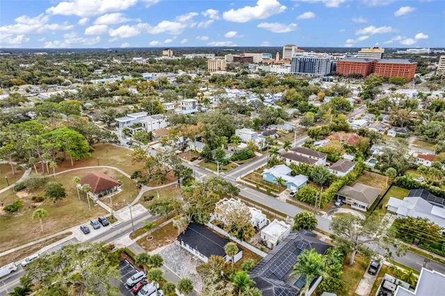 an aerial view of residential houses with outdoor space