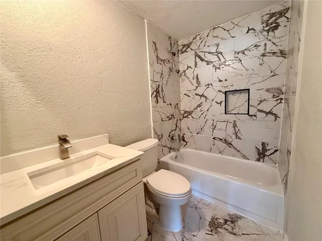 a bathroom with a sink and a toilet