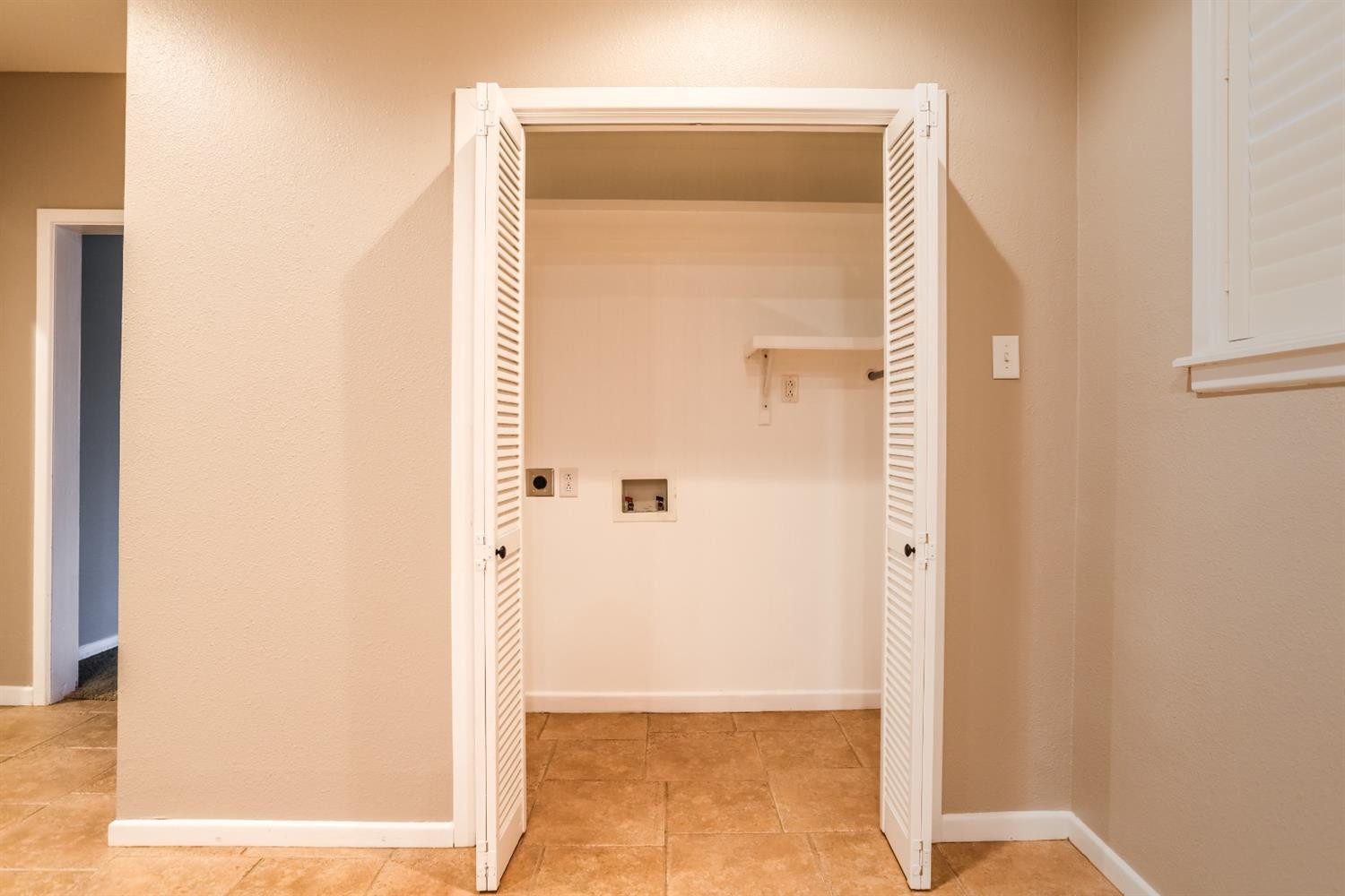 4831 10th Street Lubbock, TX 79416 - Photo 17 of 40 a view of a bathroom from a corridor