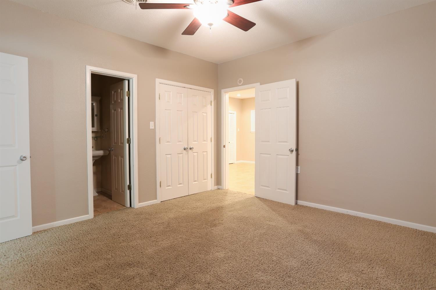 4831 10th Street Lubbock, TX 79416 - Photo 20 of 40 an empty room with closet and a ceiling fan