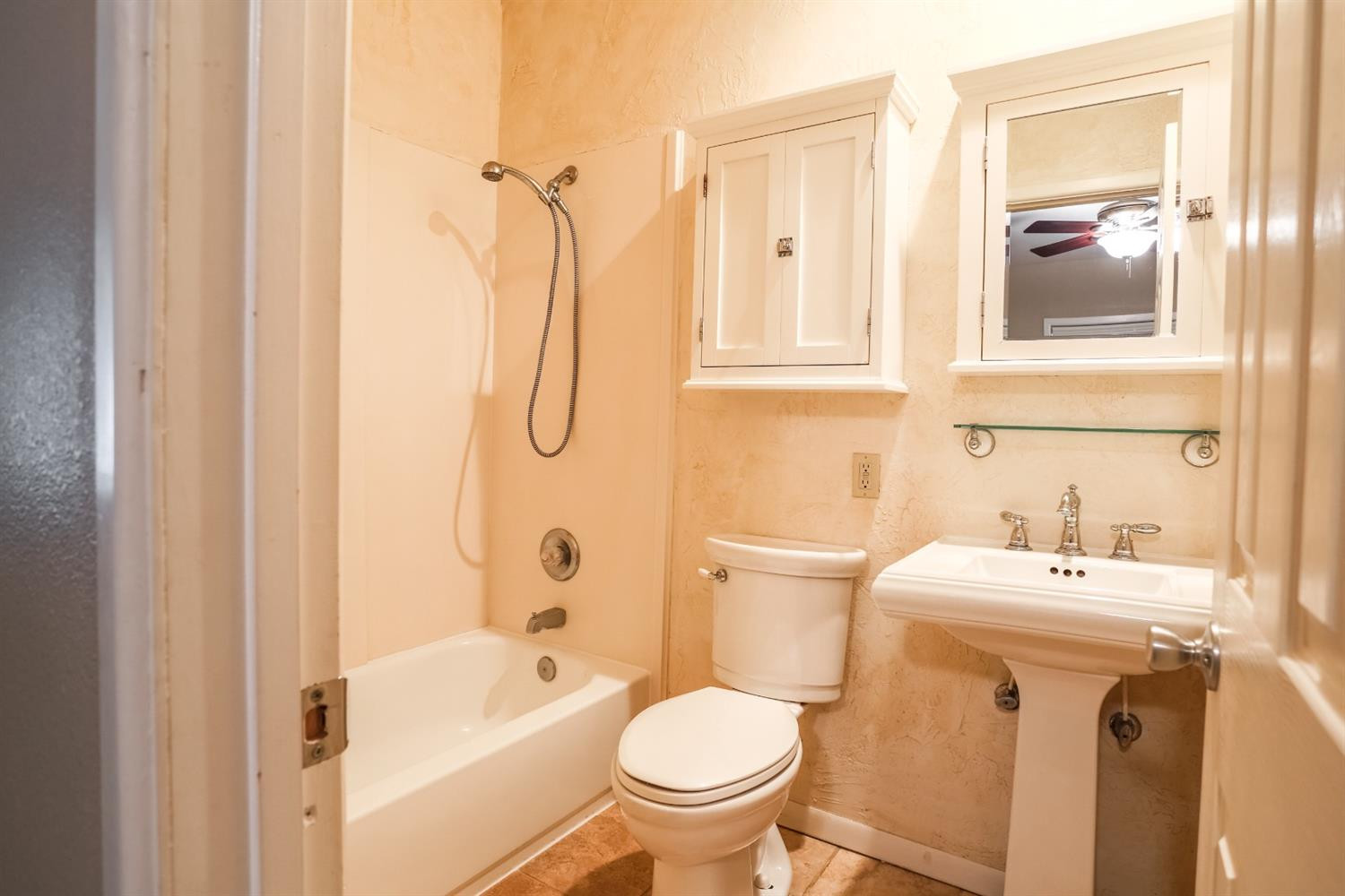 4831 10th Street Lubbock, TX 79416 - Photo 28 of 40 a bathroom with a sink toilet and shower