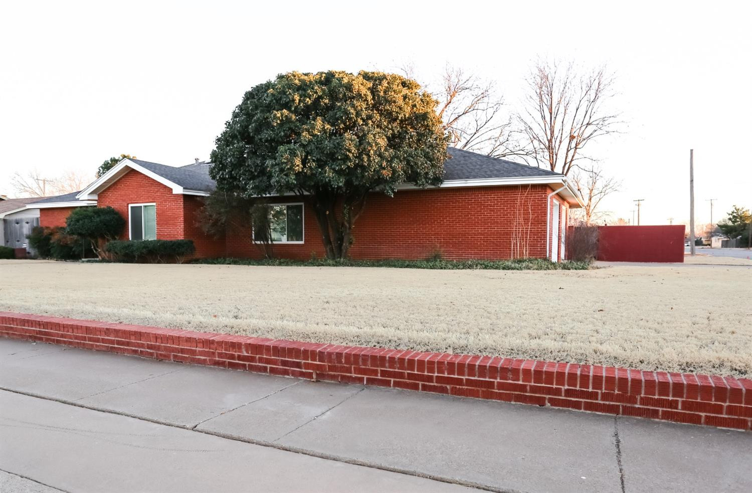 4831 10th Street Lubbock, TX 79416 - Photo 3 of 40 a front view of a house with a yard