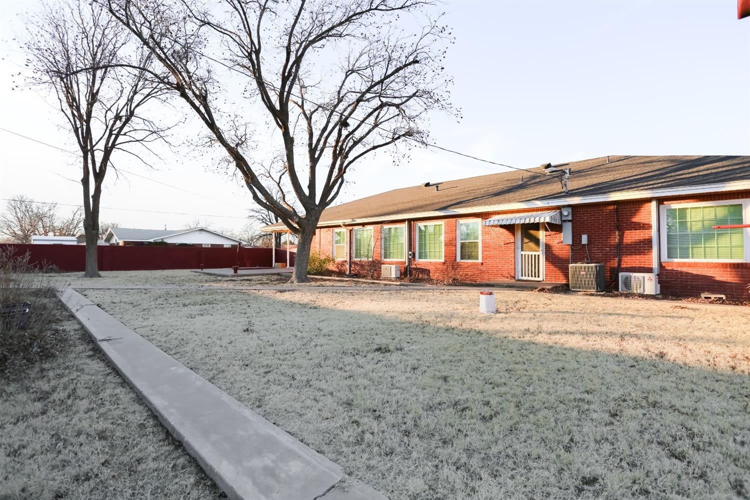 4831 10th Street Lubbock, TX 79416 - Photo 36 of 40 a view of a yard with a large tree