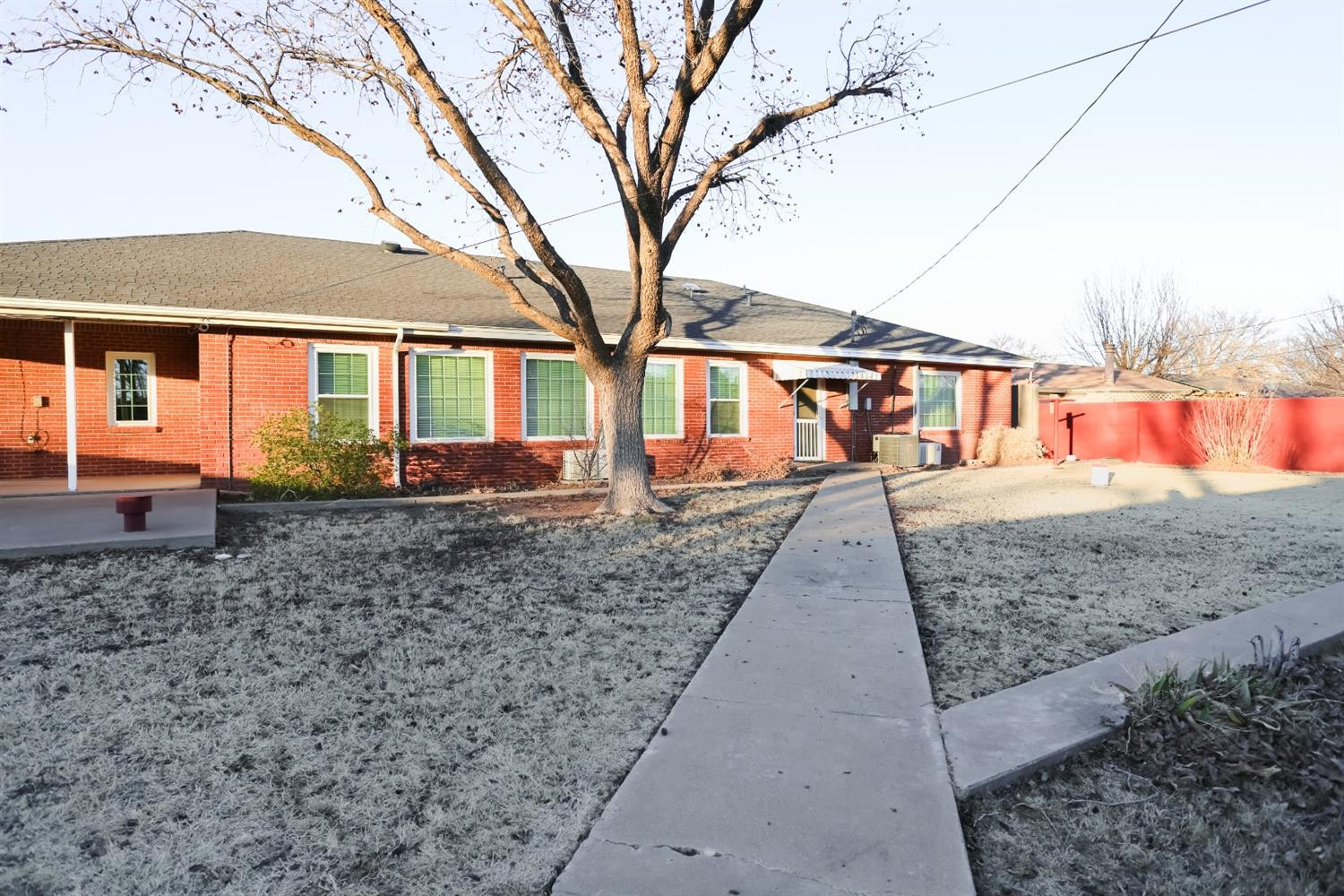 4831 10th Street Lubbock, TX 79416 - Photo 37 of 40 a view of house with a yard