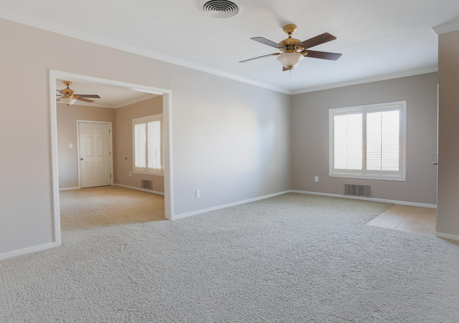 4831 10th Street Lubbock, TX 79416 - Photo 9 of 40 an empty room with fan and windows