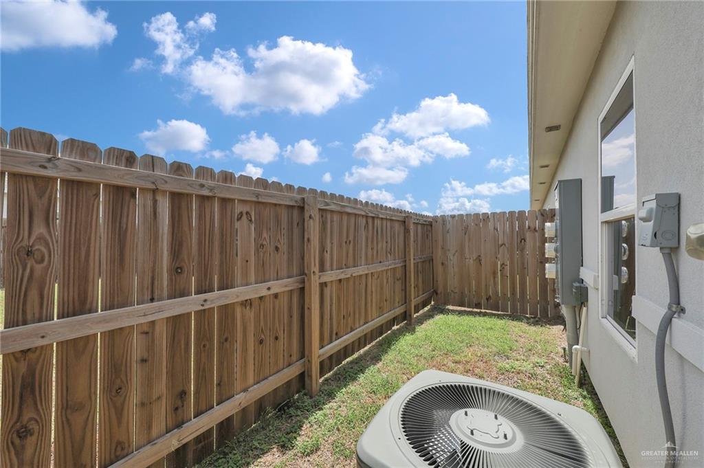 1912 Stauffers Street, Unit 1 Weslaco, TX 78596 - Photo 14 of 14 a backyard with wooden fence