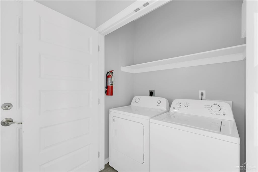 1912 Stauffers Street, Unit 1 Weslaco, TX 78596 - Photo 8 of 14 a utility room with dryer and washer