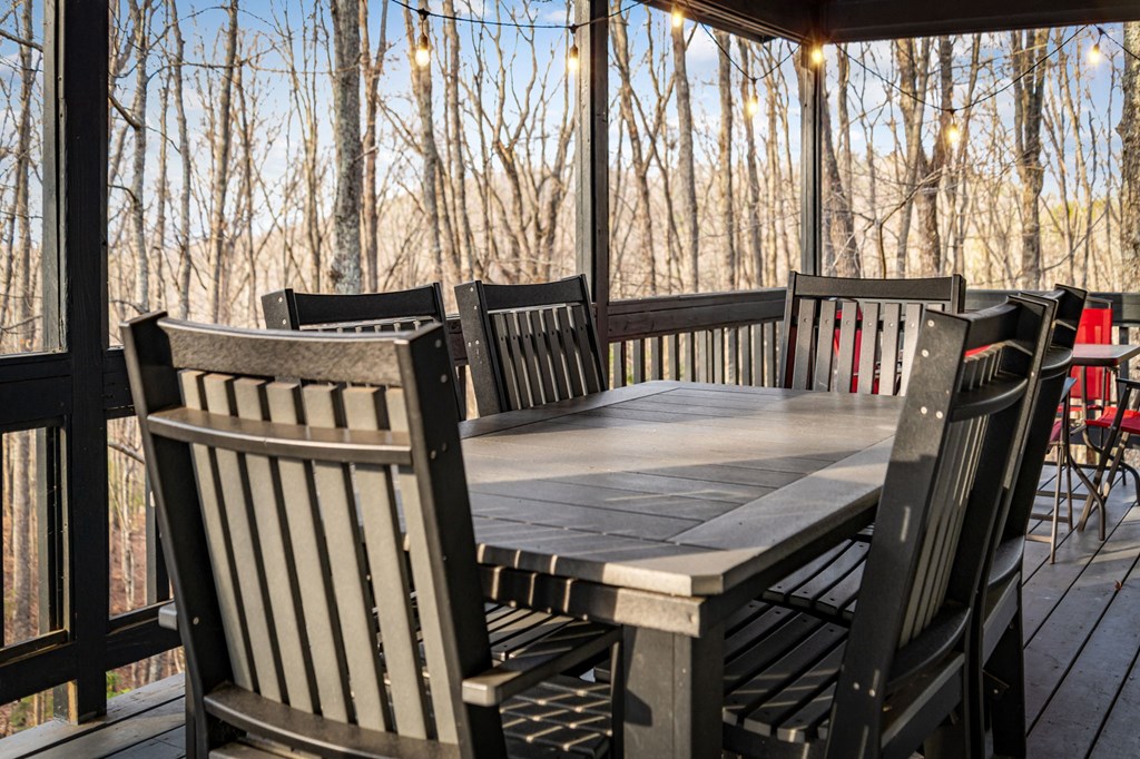 403 Sugar Mountain Road Blue Ridge, GA 30513 - Photo 75 of 84 a view of a balcony with furniture and wooden floor