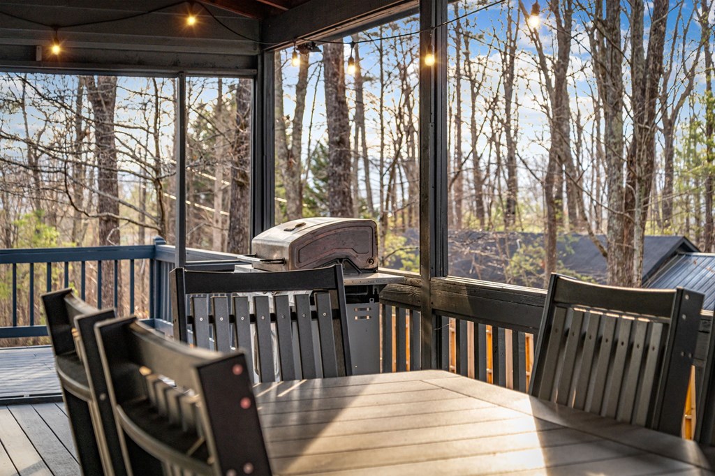 403 Sugar Mountain Road Blue Ridge, GA 30513 - Photo 76 of 84 a view of a two chairs and table in the balcony