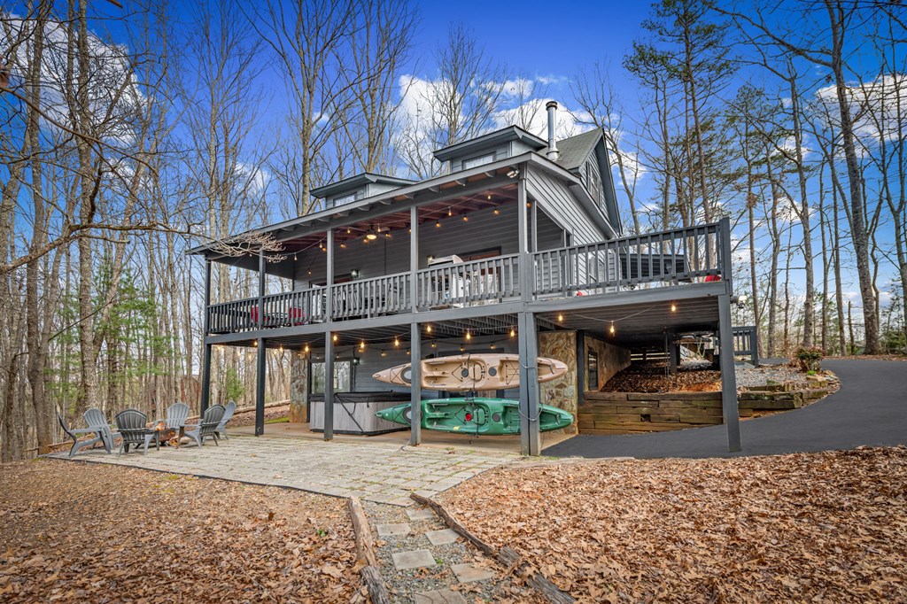 403 Sugar Mountain Road Blue Ridge, GA 30513 - Photo 78 of 84 a front view of a house with a garden