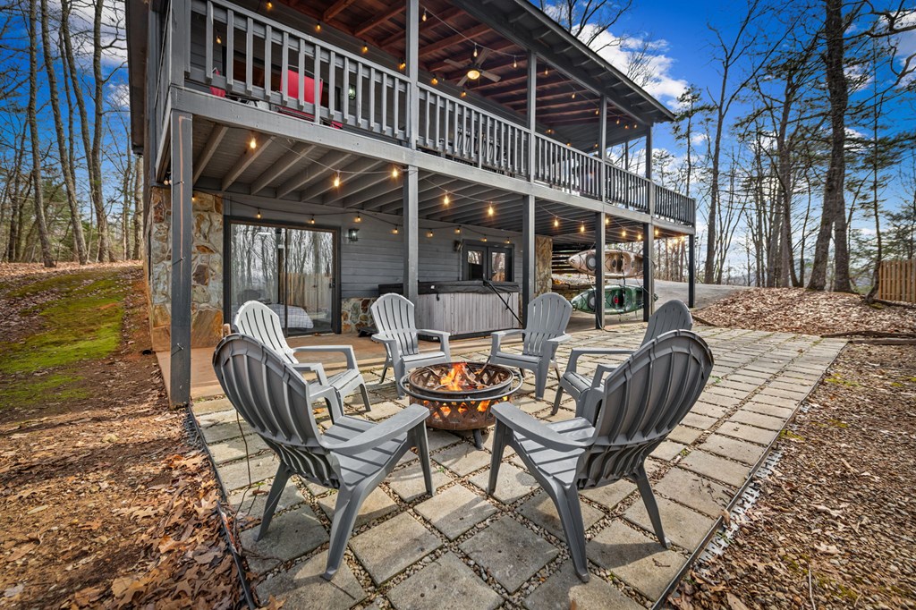 403 Sugar Mountain Road Blue Ridge, GA 30513 - Photo 8 of 84 a view of a chairs and table in the patio