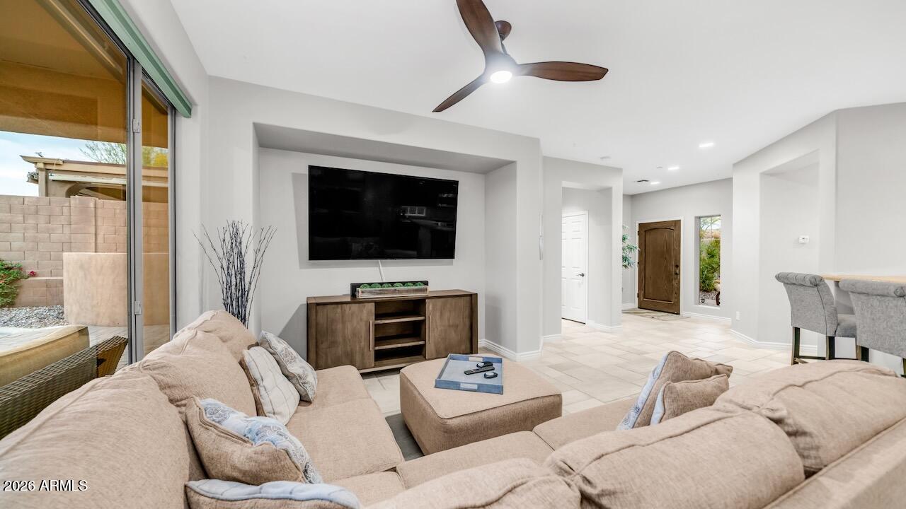 41902 North Crooked Stick Road Anthem, AZ 85086 - Photo 13 of 41 a living room with furniture and a flat screen tv