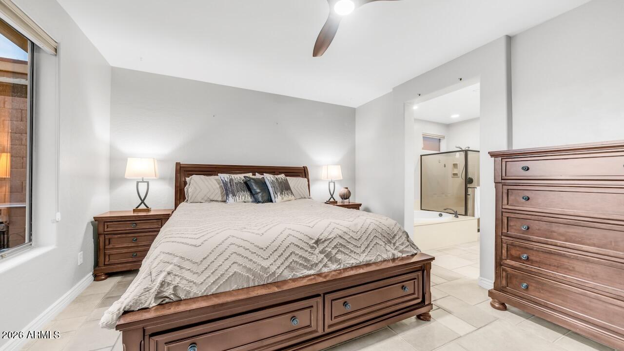 41902 North Crooked Stick Road Anthem, AZ 85086 - Photo 19 of 41 a bedroom with a bed and wooden floor