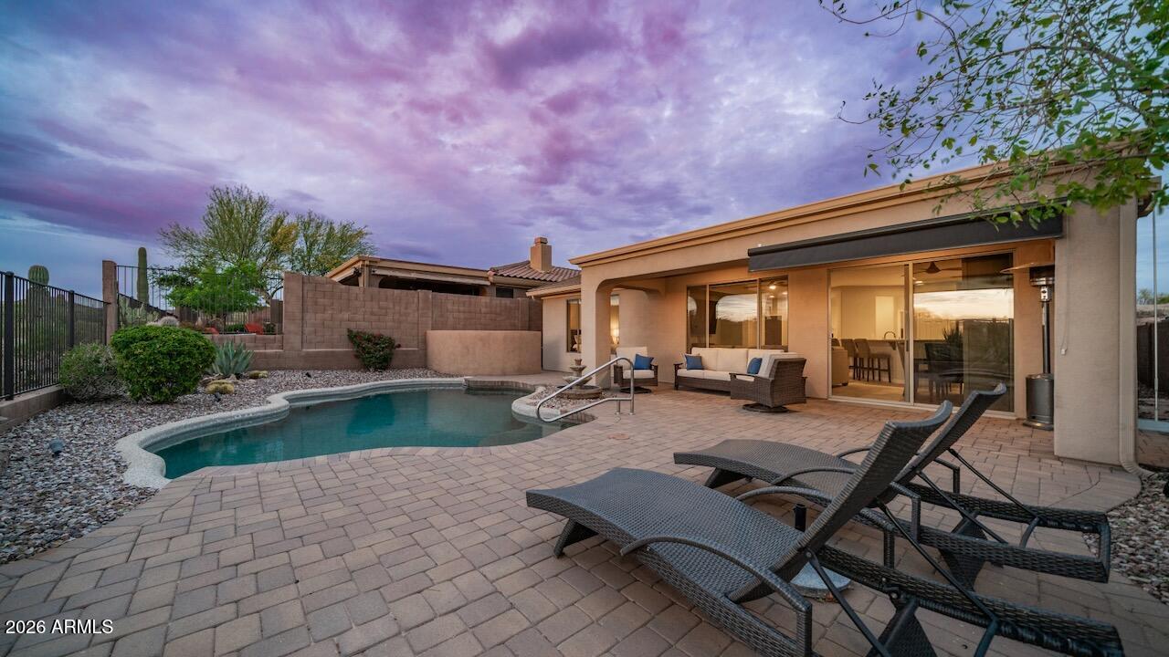 41902 North Crooked Stick Road Anthem, AZ 85086 - Photo 25 of 41 a view of a backyard with swimming pool and sitting area