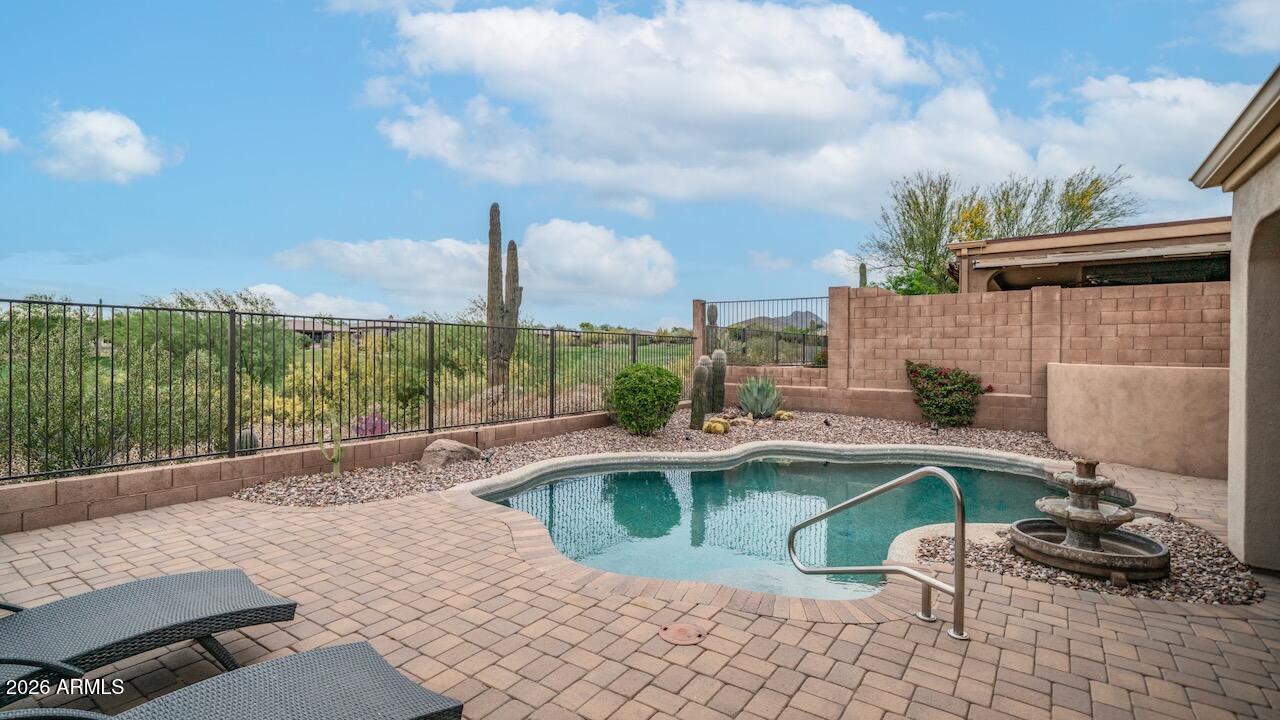 41902 North Crooked Stick Road Anthem, AZ 85086 - Photo 26 of 41 a view of a patio with a table and chairs