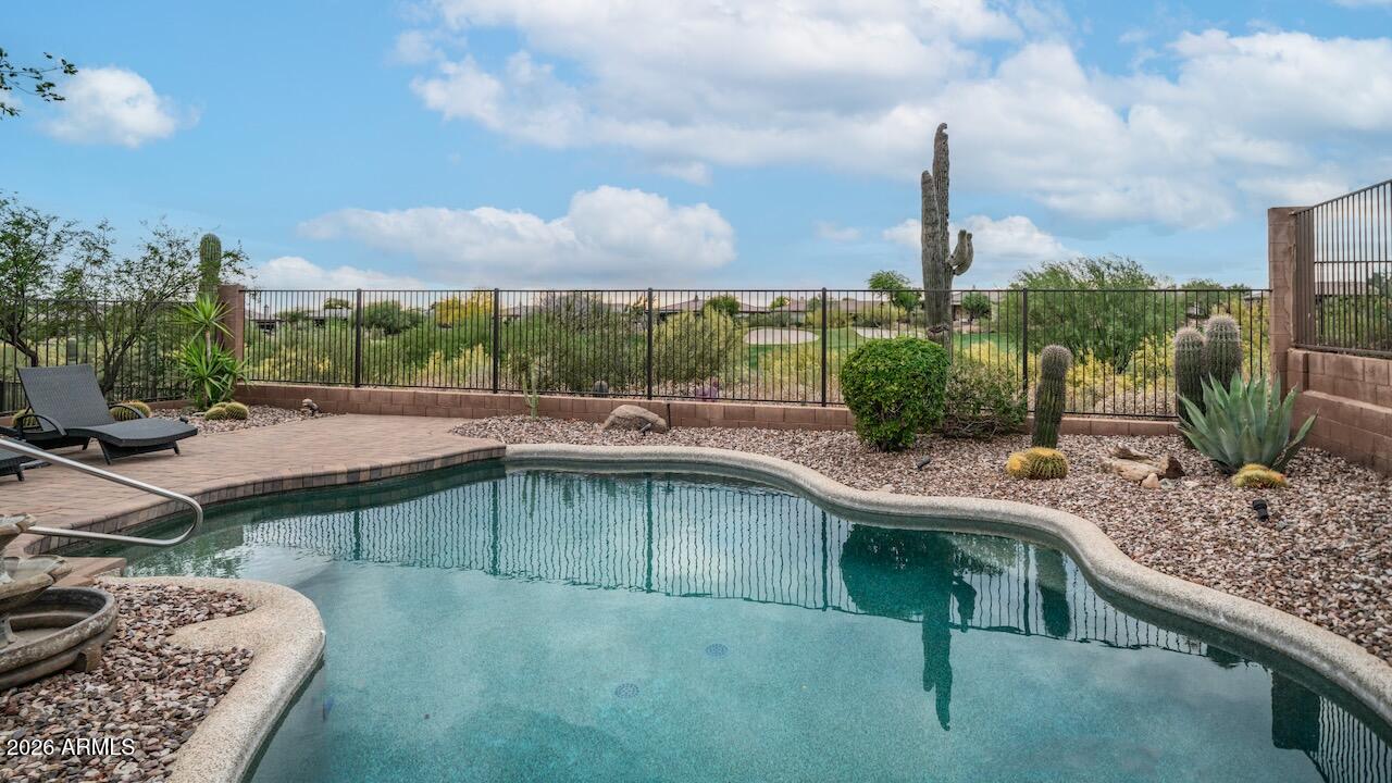 41902 North Crooked Stick Road Anthem, AZ 85086 - Photo 30 of 41 a swimming pool with outdoor seating and plants