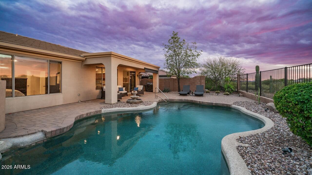 41902 North Crooked Stick Road Anthem, AZ 85086 - Photo 34 of 41 a view of a house with swimming pool and sitting area