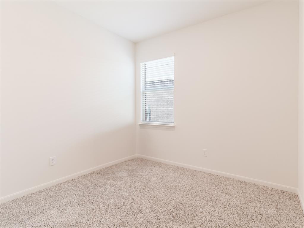 608 Aqueduct Drive Seagoville, TX 75159 - Photo 16 of 20 an empty room with a window