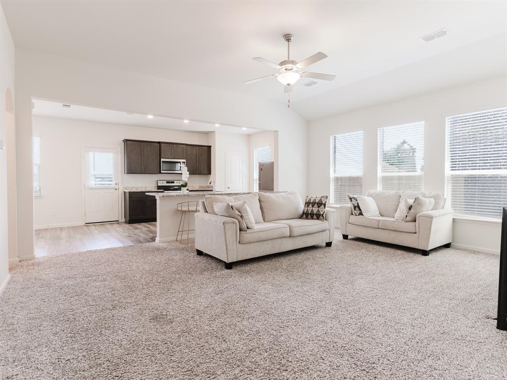 608 Aqueduct Drive Seagoville, TX 75159 - Photo 2 of 20 a living room with furniture and a flat screen tv