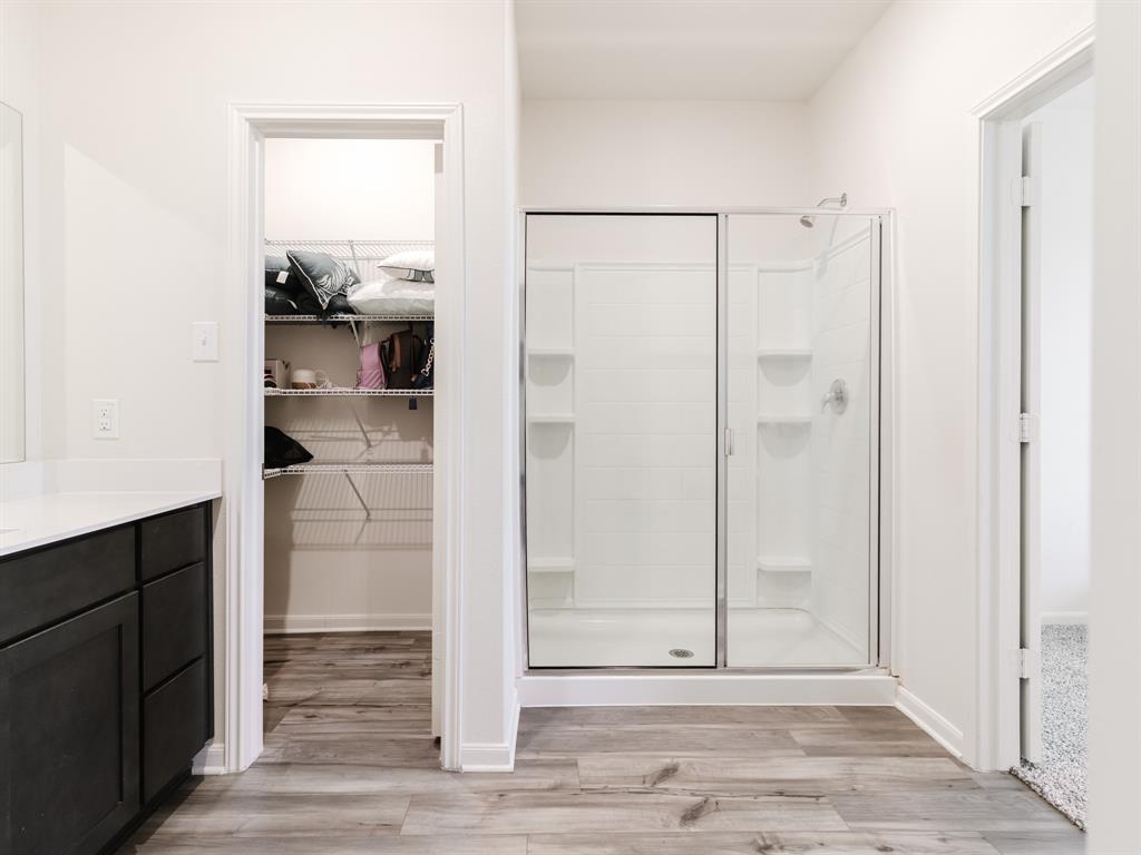 608 Aqueduct Drive Seagoville, TX 75159 - Photo 8 of 20 a view of a bathroom with wooden floor