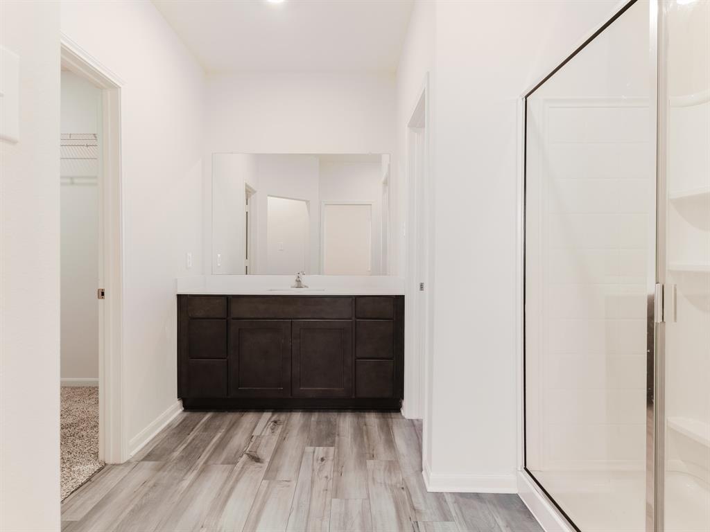 608 Aqueduct Drive Seagoville, TX 75159 - Photo 9 of 20 a bathroom with a sink and a mirror