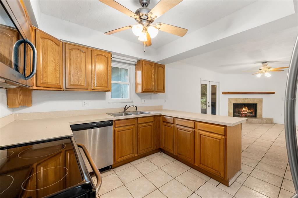 3116 West University Avenue Gainesville, FL 32607 - Photo 12 of 31 a kitchen with sink cabinets and window