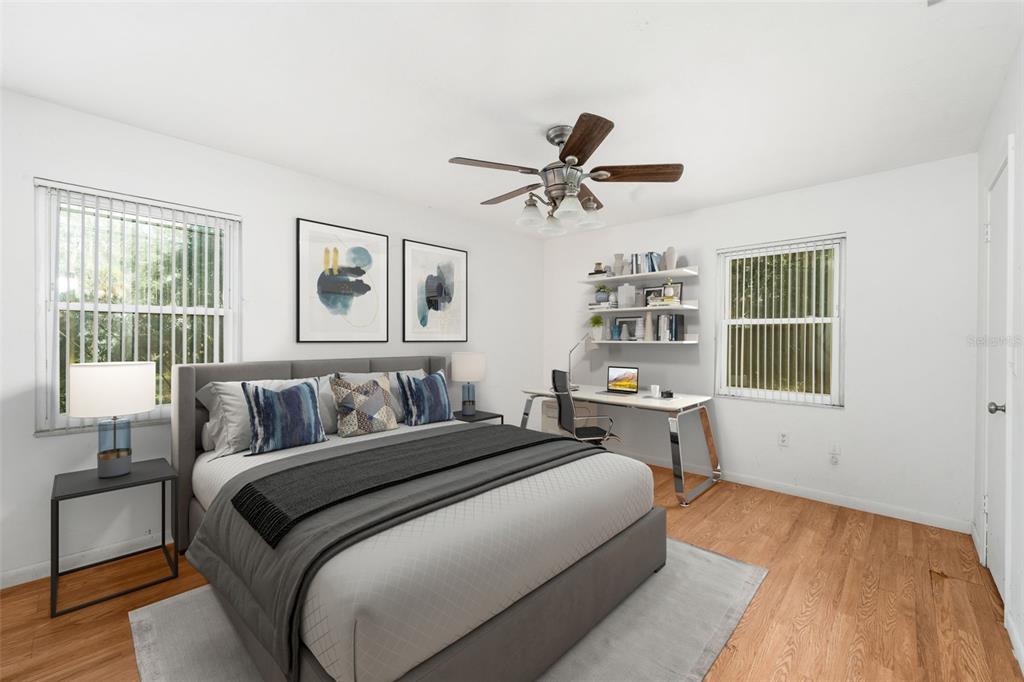 3116 West University Avenue Gainesville, FL 32607 - Photo 13 of 31 a bed room with a bed and a window