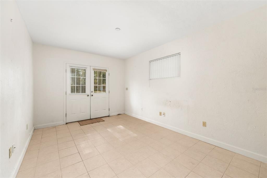 3116 West University Avenue Gainesville, FL 32607 - Photo 21 of 31 an empty room with windows