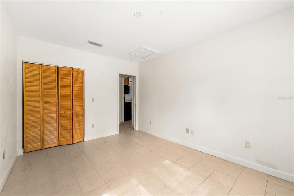 3116 West University Avenue Gainesville, FL 32607 - Photo 22 of 31 an empty room with closet