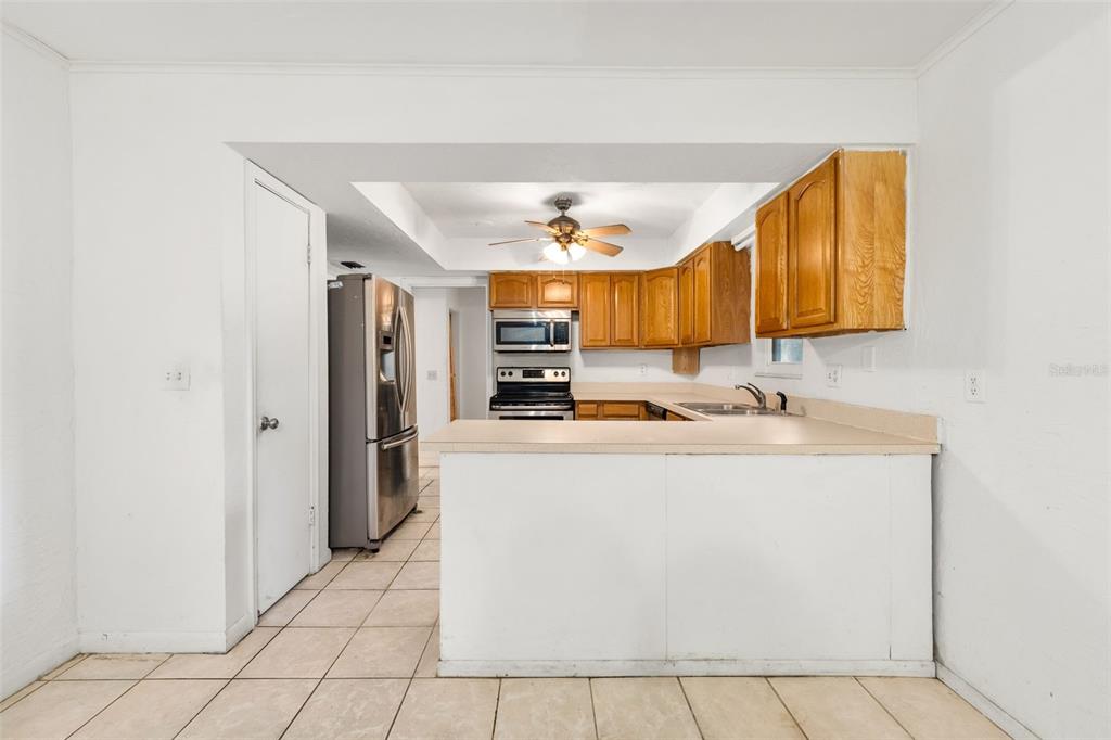 3116 West University Avenue Gainesville, FL 32607 - Photo 10 of 31 a view of kitchen with stainless steel appliances a sink and a refrigerator