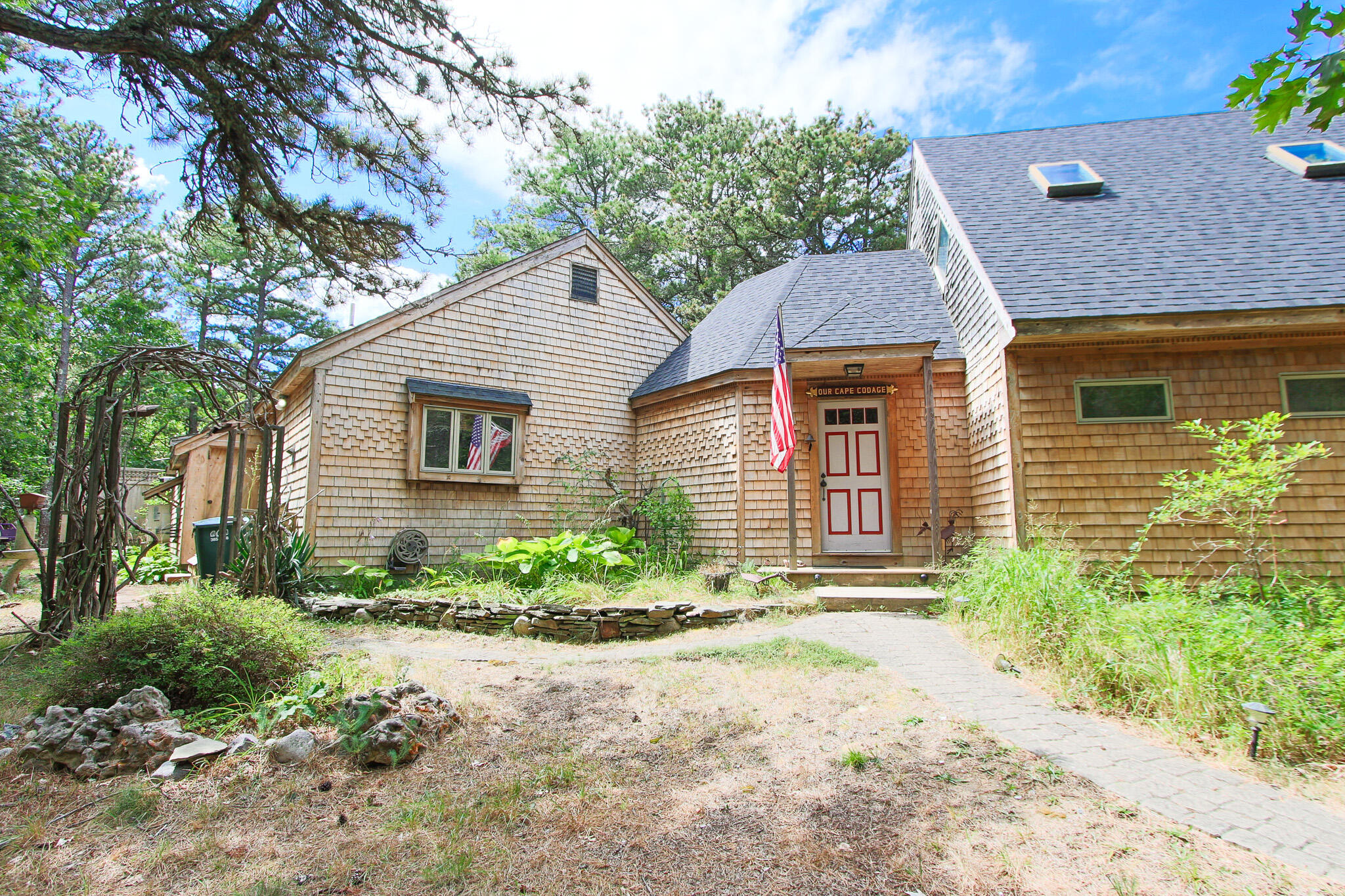 a front view of a house with garden