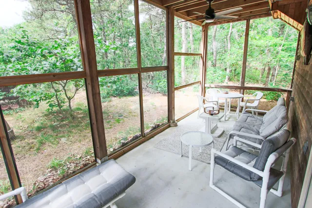 a living room with large windows