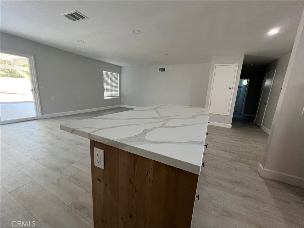 7561 Donna Avenue Reseda, CA 91335 - Photo 12 of 30 wooden floor in an empty room with a window