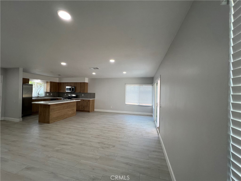 7561 Donna Avenue Reseda, CA 91335 - Photo 13 of 30 a view of kitchen with kitchen island stainless steel appliances a sink and cabinets