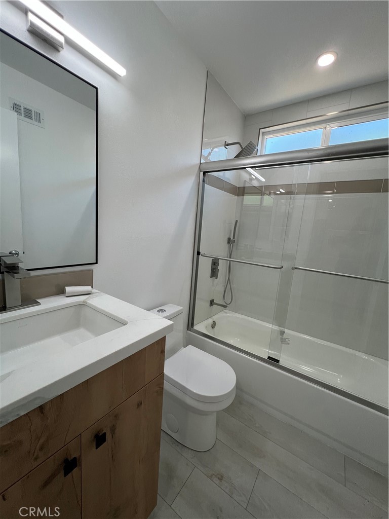 7561 Donna Avenue Reseda, CA 91335 - Photo 14 of 30 a bathroom with a sink a toilet and shower