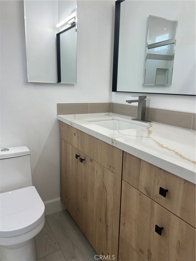 7561 Donna Avenue Reseda, CA 91335 - Photo 17 of 30 a bathroom with a sink and a toilet