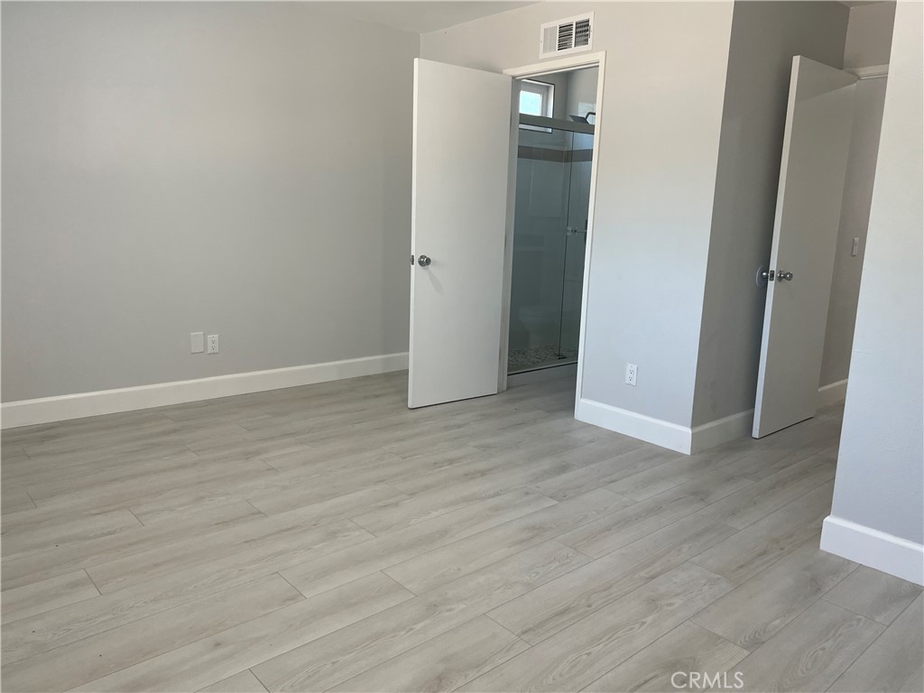 7561 Donna Avenue Reseda, CA 91335 - Photo 18 of 30 an empty room with wooden floor and closet