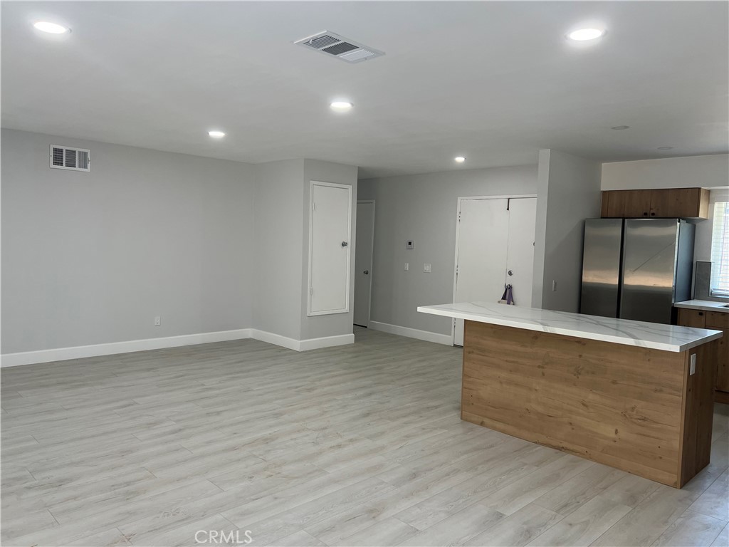 7561 Donna Avenue Reseda, CA 91335 - Photo 2 of 30 a view of kitchen with stainless steel appliances wooden floor and large window
