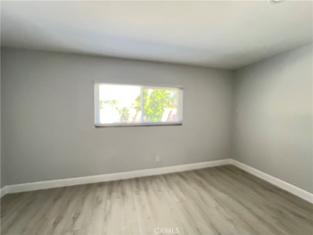 7561 Donna Avenue Reseda, CA 91335 - Photo 21 of 30 wooden floor in an empty room with a window