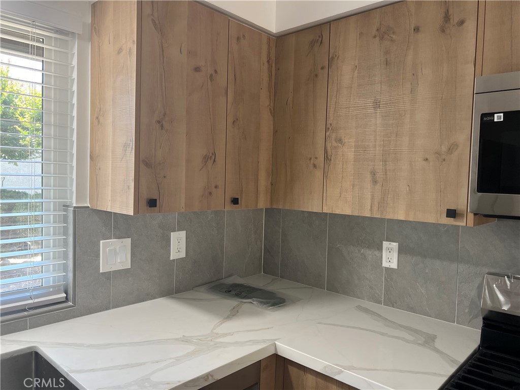 7561 Donna Avenue Reseda, CA 91335 - Photo 8 of 30 a bathroom with a sink and a mirror