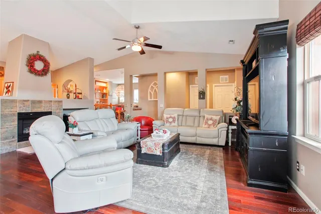 a living room with furniture and a fireplace