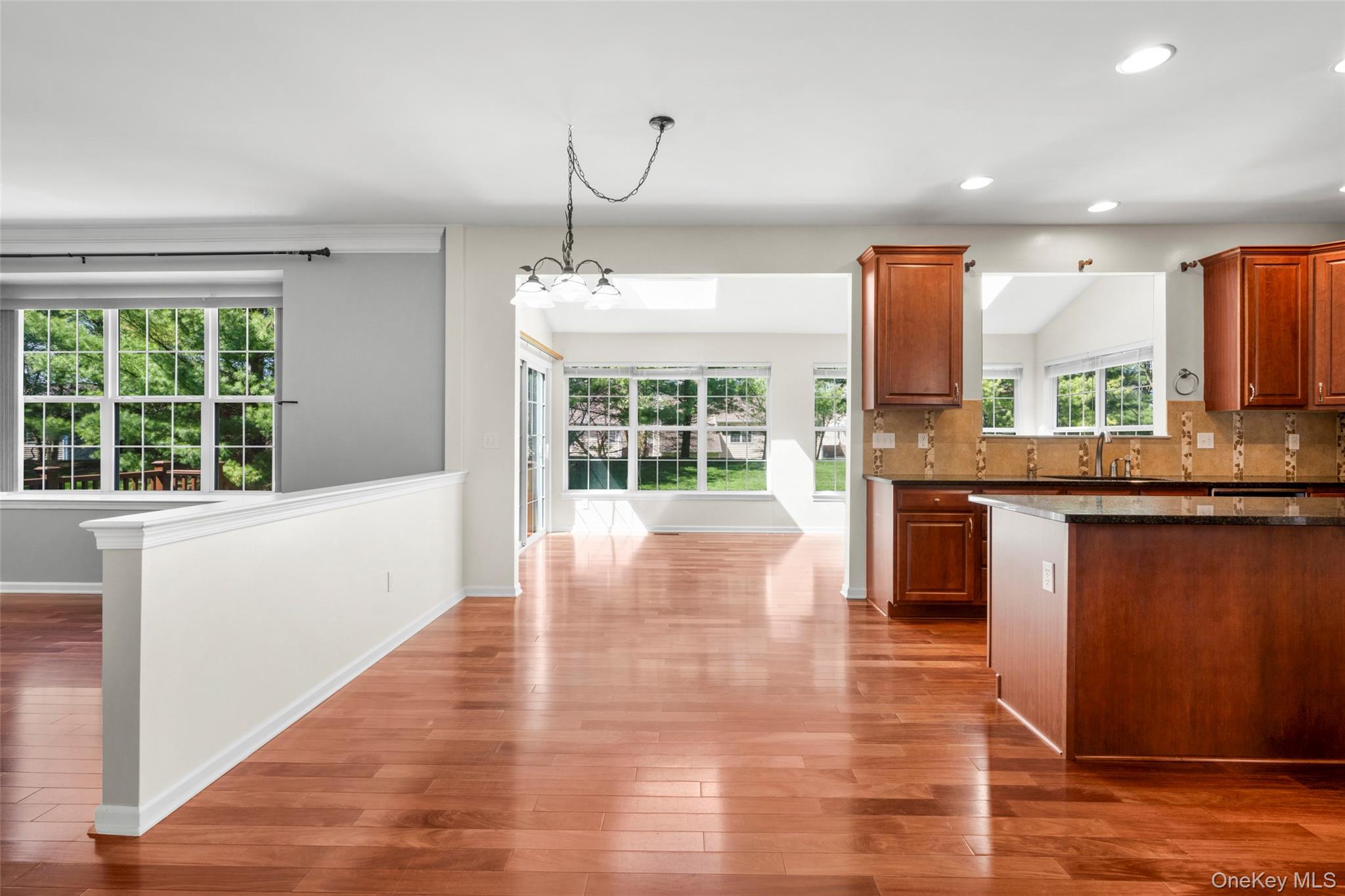 411 Vassar Place Fishkill, NY 12524 - Photo 11 of 39 a view of kitchen with granite countertop window and wooden floor